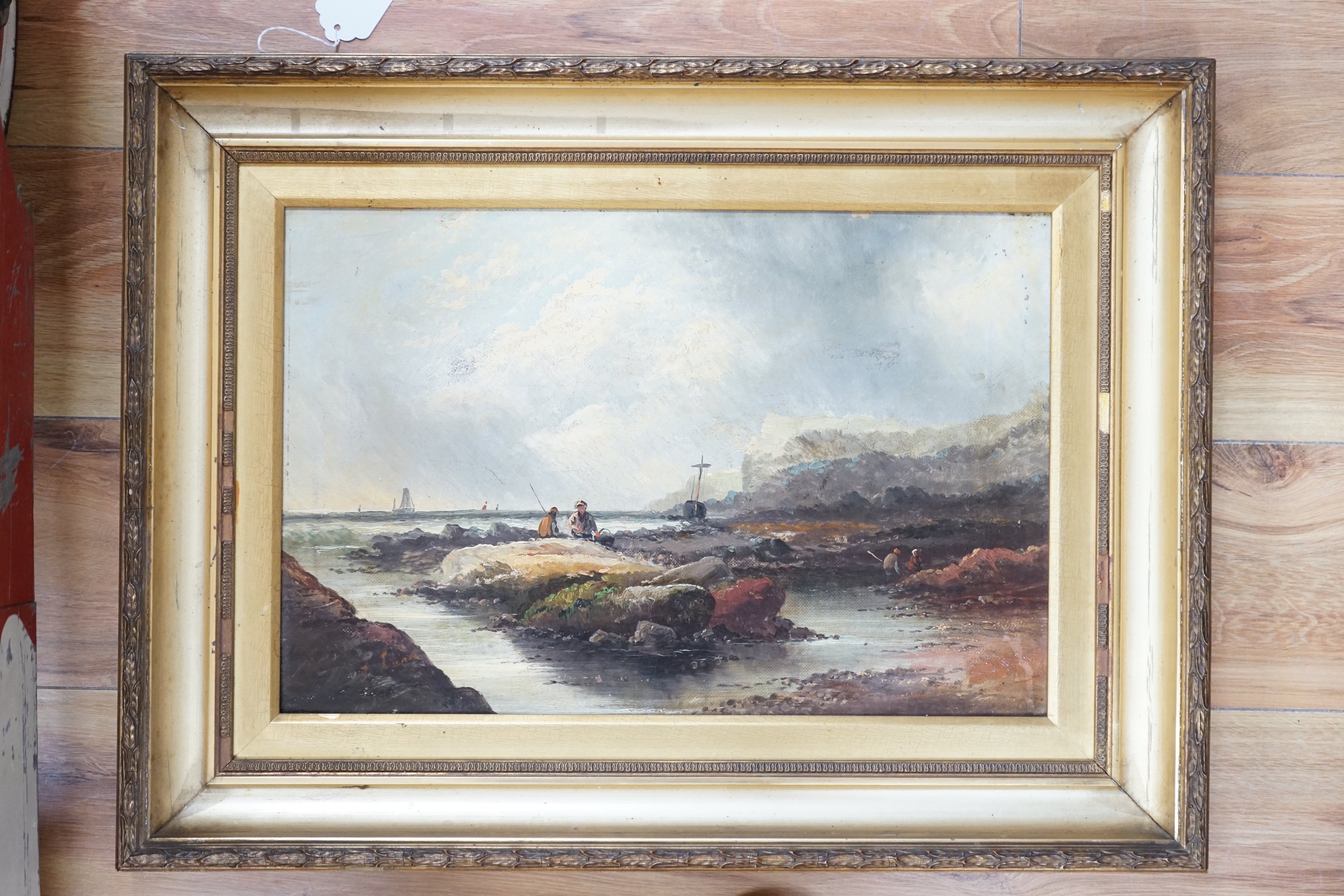 Late 19th/early 20th century school, oil on canvas, Coastal scene with figures collecting shellfish, unsigned, 29 x 44cm
